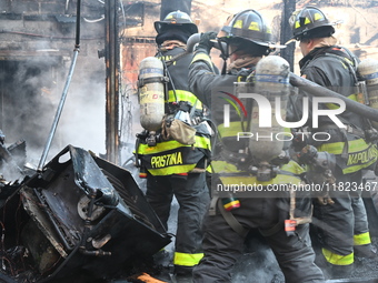 Large fire affects a strip mall in the Rego Park section of Queens, New York, United States on November 30, 2024. Around 11:00 am, Saturday...