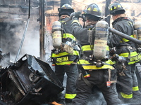 Large fire affects a strip mall in the Rego Park section of Queens, New York, United States on November 30, 2024. Around 11:00 am, Saturday...