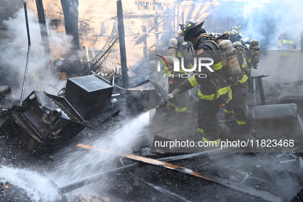 Large fire affects a strip mall in the Rego Park section of Queens, New York, United States on November 30, 2024. Around 11:00 am, Saturday...