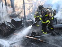 Large fire affects a strip mall in the Rego Park section of Queens, New York, United States on November 30, 2024. Around 11:00 am, Saturday...