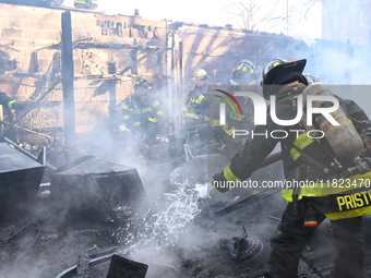 Large fire affects a strip mall in the Rego Park section of Queens, New York, United States on November 30, 2024. Around 11:00 am, Saturday...