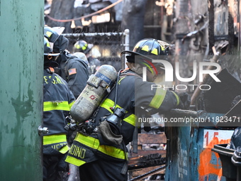 Large fire affects a strip mall in the Rego Park section of Queens, New York, United States on November 30, 2024. Around 11:00 am, Saturday...