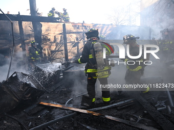 Large fire affects a strip mall in the Rego Park section of Queens, New York, United States on November 30, 2024. Around 11:00 am, Saturday...