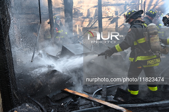 Large fire affects a strip mall in the Rego Park section of Queens, New York, United States on November 30, 2024. Around 11:00 am, Saturday...