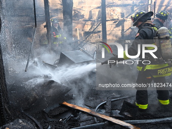 Large fire affects a strip mall in the Rego Park section of Queens, New York, United States on November 30, 2024. Around 11:00 am, Saturday...