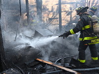 Large fire affects a strip mall in the Rego Park section of Queens, New York, United States on November 30, 2024. Around 11:00 am, Saturday...