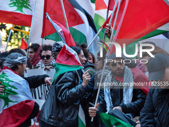 Citizens and activists gather to participate in a demonstration in solidarity with the Palestinian people in Rome, Italy, on November 30, 20...