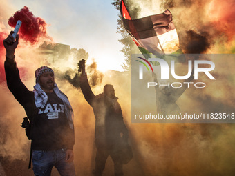 Citizens and activists gather to participate in a demonstration in solidarity with the Palestinian people in Rome, Italy, on November 30, 20...