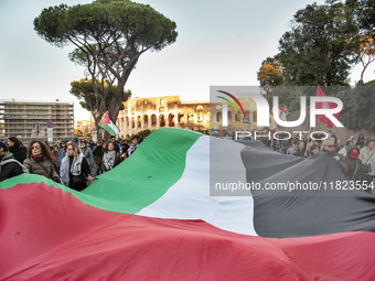 Citizens and activists gather to participate in a demonstration in solidarity with the Palestinian people in Rome, Italy, on November 30, 20...