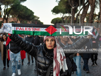 Citizens and activists gather to participate in a demonstration in solidarity with the Palestinian people in Rome, Italy, on November 30, 20...