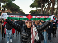 Citizens and activists gather to participate in a demonstration in solidarity with the Palestinian people in Rome, Italy, on November 30, 20...