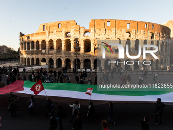 People and various associations participate in a national pro-Palestine demonstration in Rome, Italy, on November 30, 2024, against the geno...