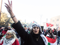 People and various associations participate in a national pro-Palestine demonstration in Rome, Italy, on November 30, 2024, against the geno...