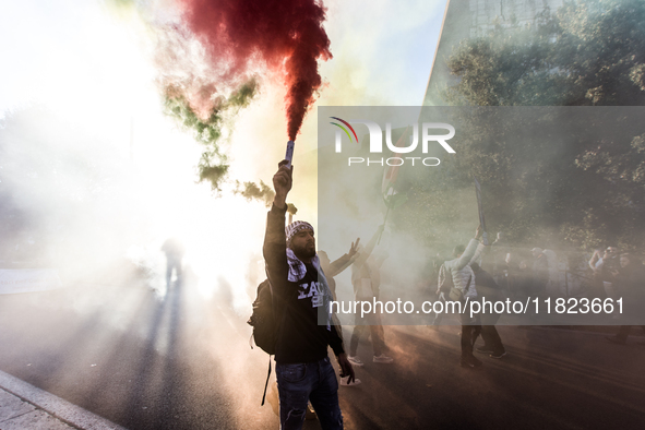 People and various associations participate in a national pro-Palestine demonstration in Rome, Italy, on November 30, 2024, against the geno...