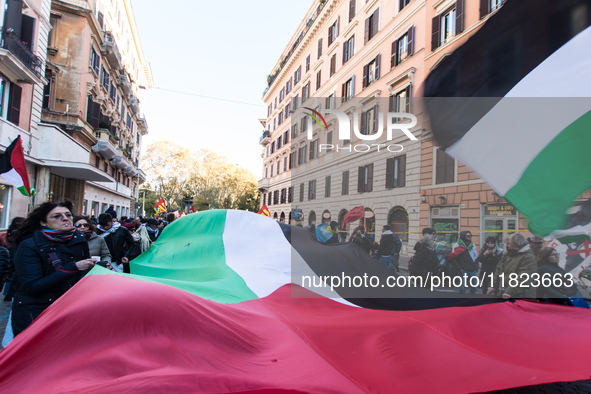 People and various associations participate in a national pro-Palestine demonstration in Rome, Italy, on November 30, 2024, against the geno...