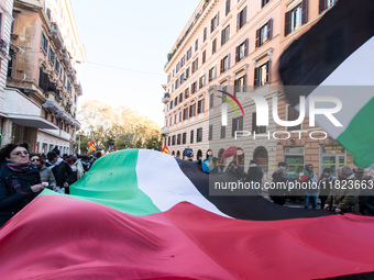 People and various associations participate in a national pro-Palestine demonstration in Rome, Italy, on November 30, 2024, against the geno...