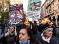 People and various associations participate in a national pro-Palestine demonstration in Rome, Italy, on November 30, 2024, against the geno...