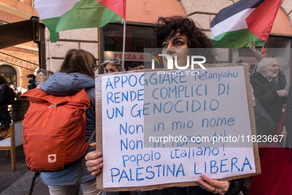 People and various associations participate in a national pro-Palestine demonstration in Rome, Italy, on November 30, 2024, against the geno...