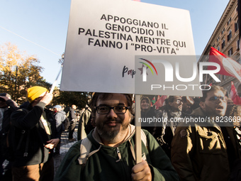 People and various associations participate in a national pro-Palestine demonstration in Rome, Italy, on November 30, 2024, against the geno...