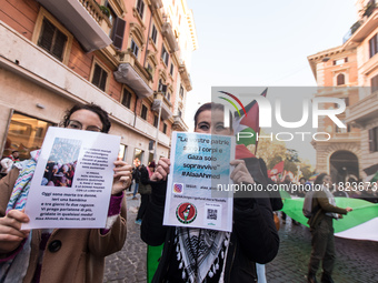 People and various associations participate in a national pro-Palestine demonstration in Rome, Italy, on November 30, 2024, against the geno...