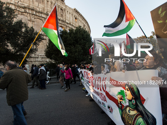 People and various associations participate in a national pro-Palestine demonstration in Rome, Italy, on November 30, 2024, against the geno...