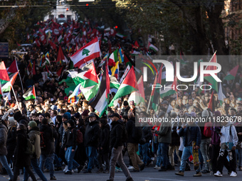 People and various associations participate in a national pro-Palestine demonstration in Rome, Italy, on November 30, 2024, against the geno...