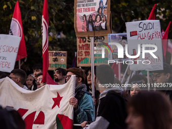 People and various associations participate in a national pro-Palestine demonstration in Rome, Italy, on November 30, 2024, against the geno...