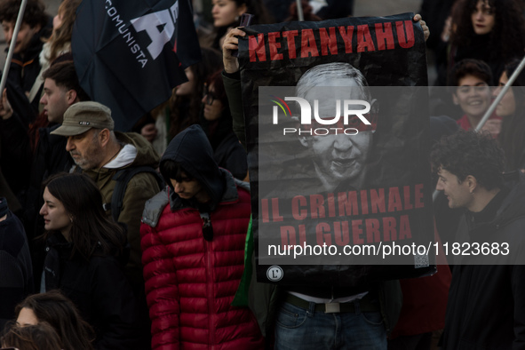 People and various associations participate in a national pro-Palestine demonstration in Rome, Italy, on November 30, 2024, against the geno...