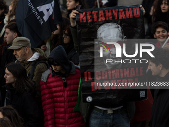 People and various associations participate in a national pro-Palestine demonstration in Rome, Italy, on November 30, 2024, against the geno...