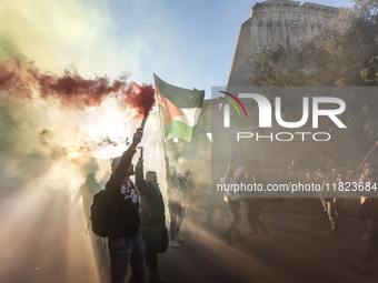 People and various associations participate in a national pro-Palestine demonstration in Rome, Italy, on November 30, 2024, against the geno...