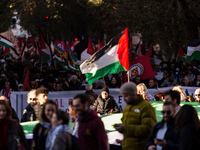 People and various associations participate in a national pro-Palestine demonstration in Rome, Italy, on November 30, 2024, against the geno...