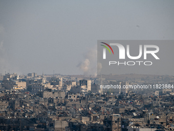 Thick columns of smoke were seen rising over the city of Aleppo on November 30, 2024, following a series of airstrikes conducted by Syrian w...