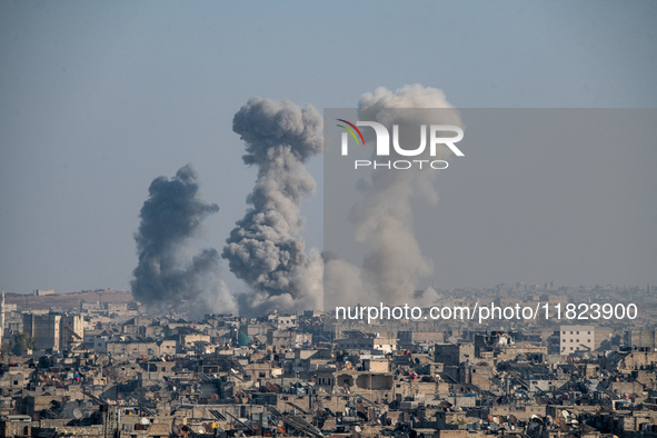 Thick columns of smoke were seen rising over the city of Aleppo on November 30, 2024, following a series of airstrikes conducted by Syrian w...