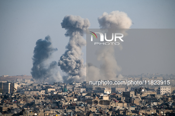 Thick columns of smoke were seen rising over the city of Aleppo on November 30, 2024, following a series of airstrikes conducted by Syrian w...