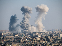 Thick columns of smoke were seen rising over the city of Aleppo on November 30, 2024, following a series of airstrikes conducted by Syrian w...