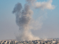 Thick columns of smoke were seen rising over the city of Aleppo on November 30, 2024, following a series of airstrikes conducted by Syrian w...