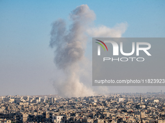 Thick columns of smoke were seen rising over the city of Aleppo on November 30, 2024, following a series of airstrikes conducted by Syrian w...