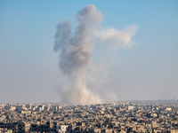 Thick columns of smoke were seen rising over the city of Aleppo on November 30, 2024, following a series of airstrikes conducted by Syrian w...