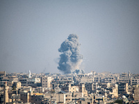 Thick columns of smoke were seen rising over the city of Aleppo on November 30, 2024, following a series of airstrikes conducted by Syrian w...