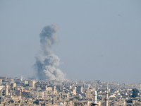 Thick columns of smoke were seen rising over the city of Aleppo on November 30, 2024, following a series of airstrikes conducted by Syrian w...