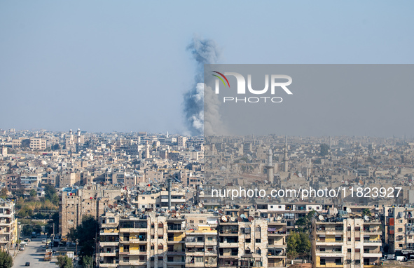 Thick columns of smoke were seen rising over the city of Aleppo on November 30, 2024, following a series of airstrikes conducted by Syrian w...