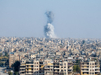 Thick columns of smoke were seen rising over the city of Aleppo on November 30, 2024, following a series of airstrikes conducted by Syrian w...