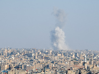 Thick columns of smoke were seen rising over the city of Aleppo on November 30, 2024, following a series of airstrikes conducted by Syrian w...