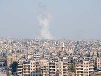 Thick columns of smoke were seen rising over the city of Aleppo on November 30, 2024, following a series of airstrikes conducted by Syrian w...