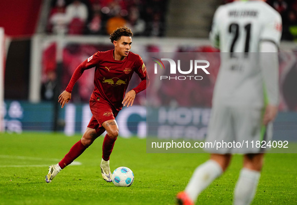 Antonio Nusa of RB Leipzig  controls the ball during the Bundesliga match between RB Leipzig and VfL Wolfsburg at Red Bull Arena, Leipzig, G...