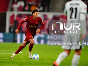 Antonio Nusa of RB Leipzig  controls the ball during the Bundesliga match between RB Leipzig and VfL Wolfsburg at Red Bull Arena, Leipzig, G...