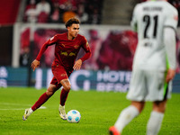 Antonio Nusa of RB Leipzig  controls the ball during the Bundesliga match between RB Leipzig and VfL Wolfsburg at Red Bull Arena, Leipzig, G...