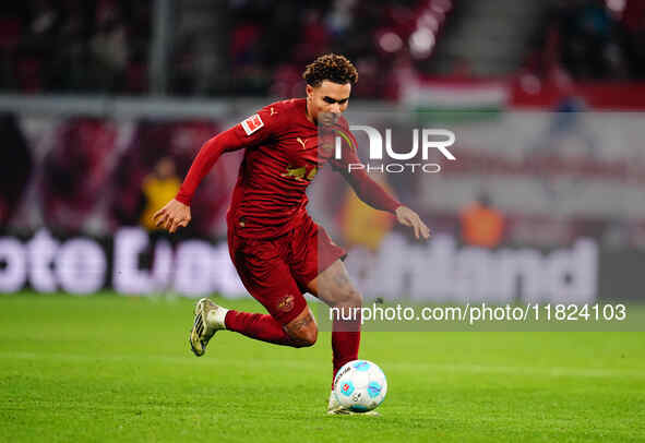 Antonio Nusa of RB Leipzig  controls the ball during the Bundesliga match between RB Leipzig and VfL Wolfsburg at Red Bull Arena, Leipzig, G...