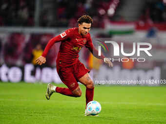 Antonio Nusa of RB Leipzig  controls the ball during the Bundesliga match between RB Leipzig and VfL Wolfsburg at Red Bull Arena, Leipzig, G...