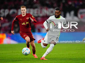 Ridle Baku of VfL Wolfsburg  controls the ball during the Bundesliga match between RB Leipzig and VfL Wolfsburg at Red Bull Arena, Leipzig,...